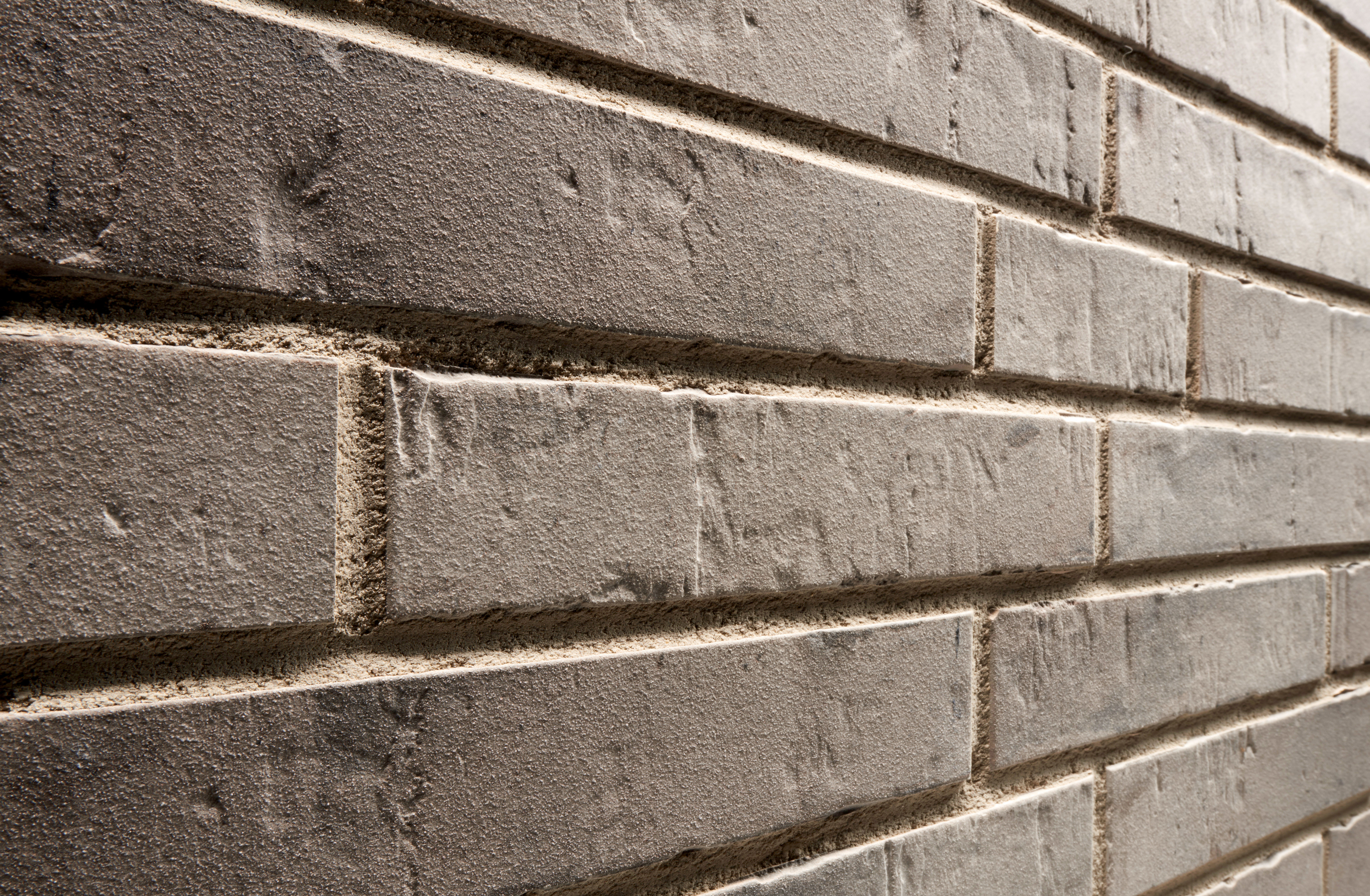 Клинкерная фасадная плитка облицовочная под кирпич Stroeher (Штроер) Kontur EG 472 grau engobiert рельефная, 440*52*12 мм